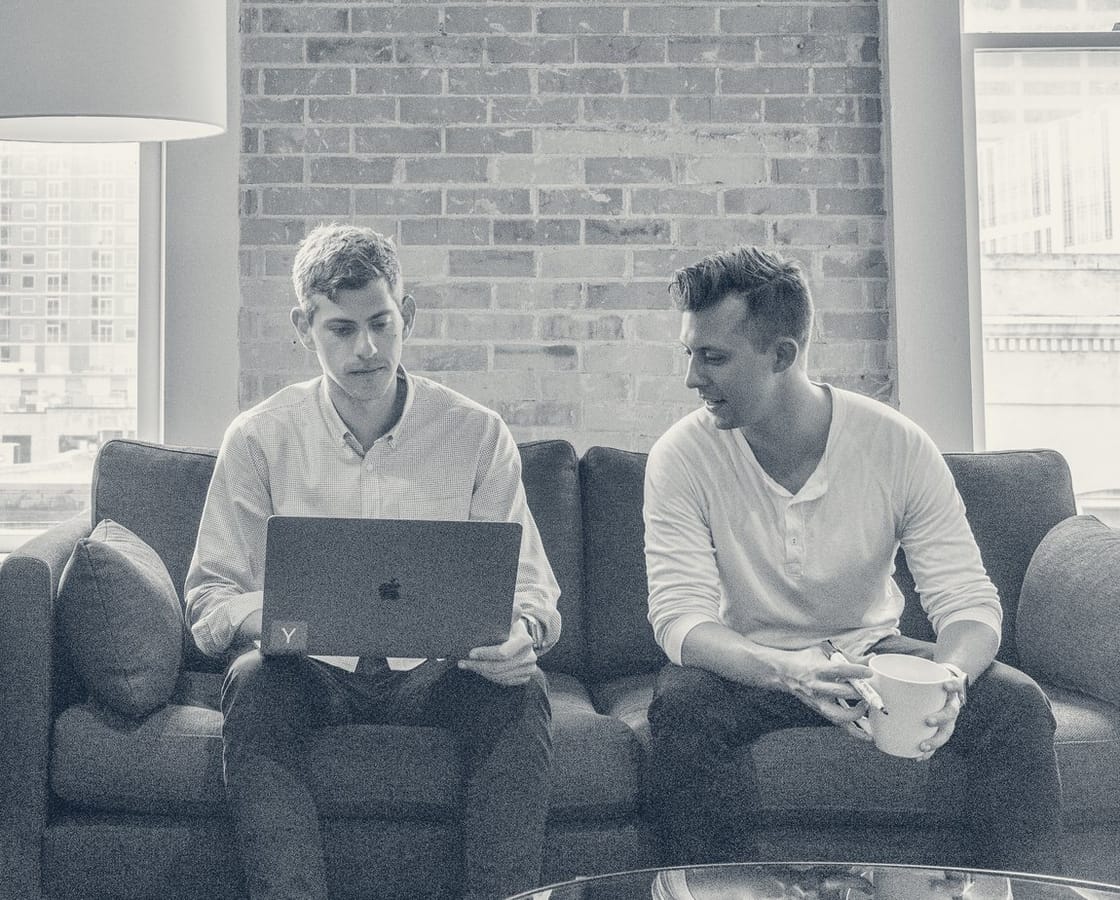 Several business owners sitting around a table in conversation